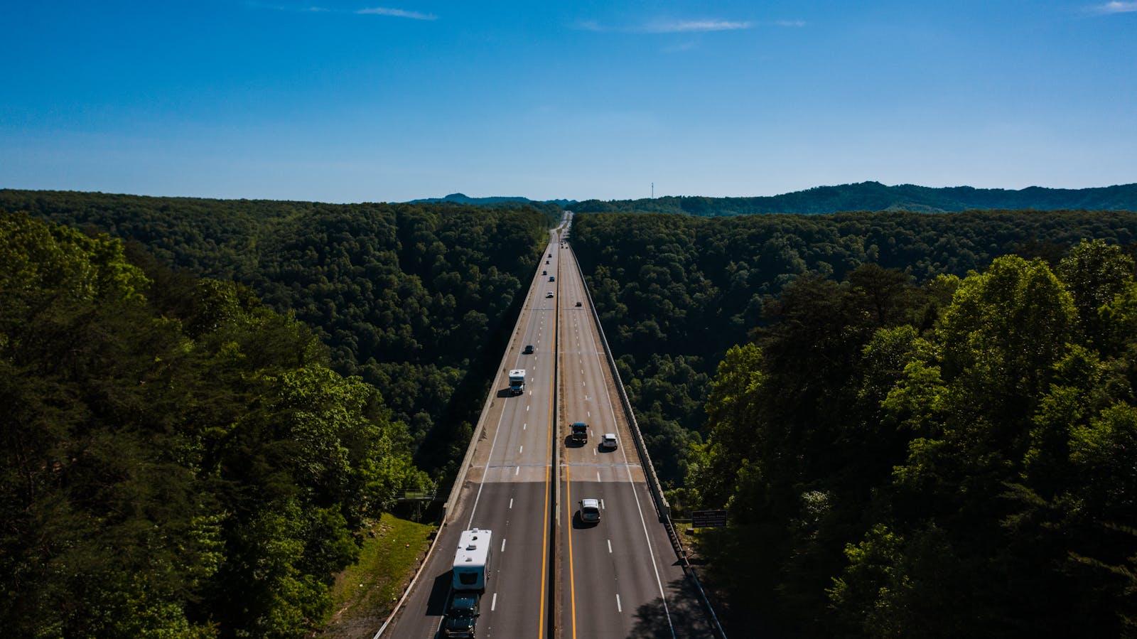 A West Virginia highway winding through forested hills